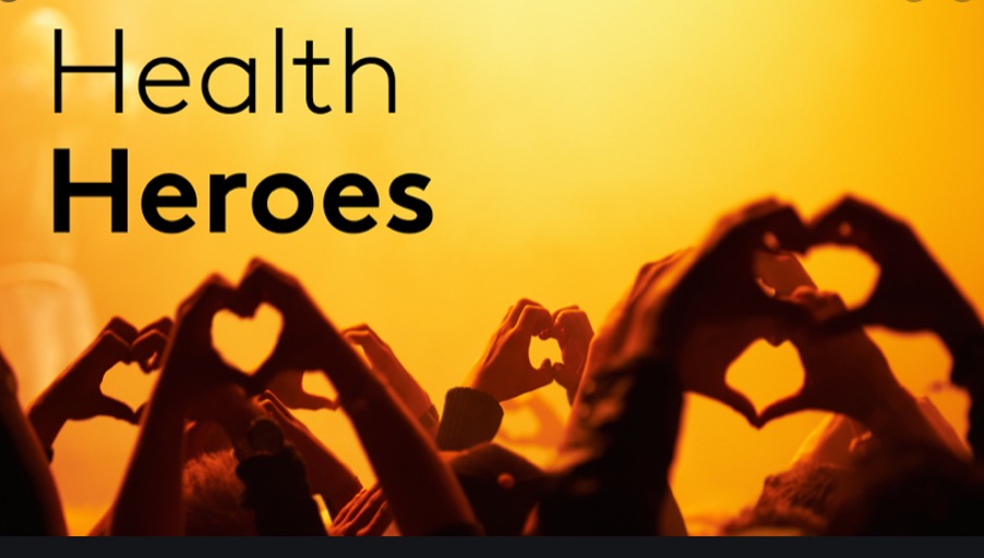 many hands in the air forming a heart shape