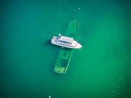 Boat floating over a sunken boat