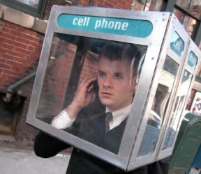 man with a telephone booth over his head