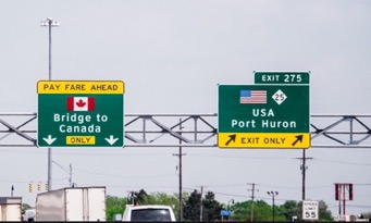 directional traffic signs at Canadian USA border