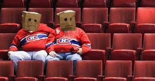 Photo of 2 Habs fans with paper bags over their heads
