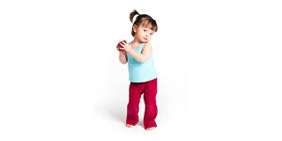 young female toddler holding an apple