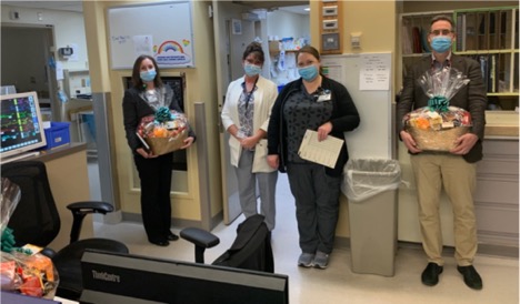 healthcare workers receiving gift baskets