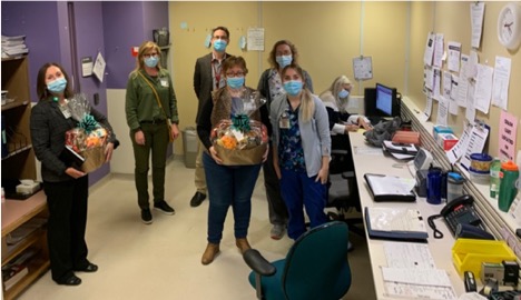 healthcare workers receiving gift baskets