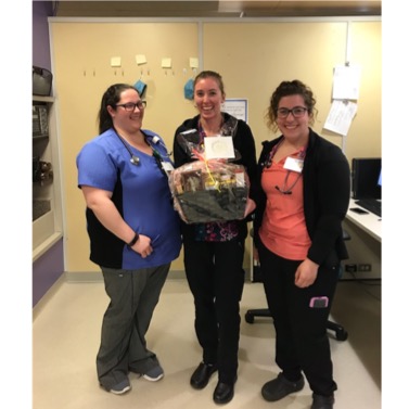photo of 3 nurses holding a gift basket