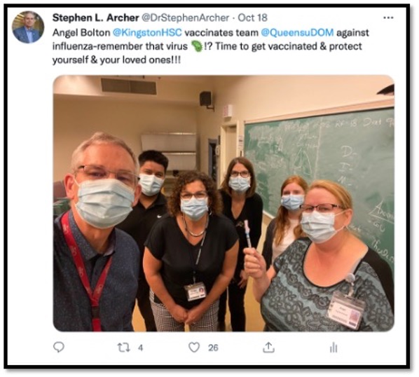 tweet of masked people getting flu shot from nurse