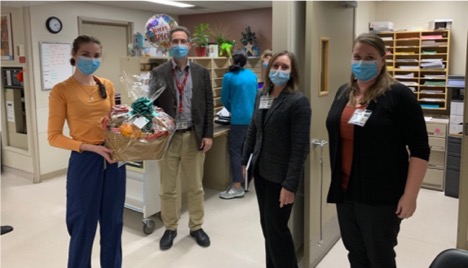 healthcare workers receiving gift baskets