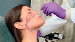 animated photo of female getting a covid nasal swab test