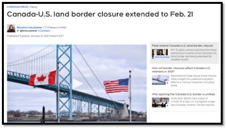 border bridge with Cdn and USA flags in the forefront