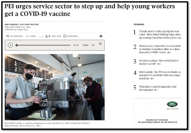young masked barista serving coffee behind a counter to a customer