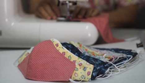 picture of lady sewing face masks