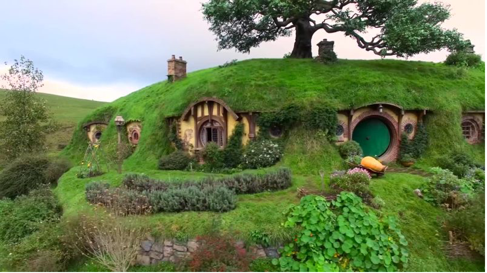 hobbits house under a hill with grass