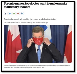photo of Toronto mayor putting on a facemark