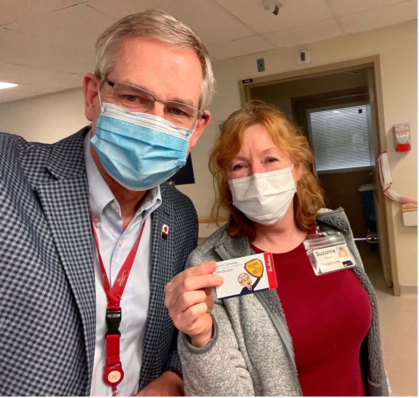 dr archer and charge nurse holding Tims card