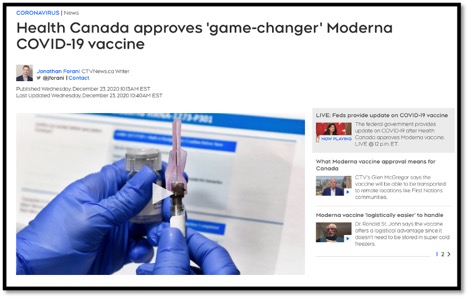 gloved hands holding a syringe