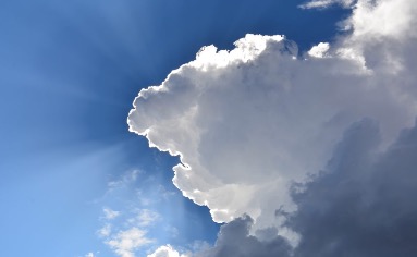 blue sky white and grey cloud with sun rays