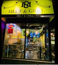 Night time photo of Melt and Grill Store front