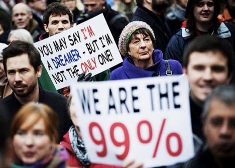 photo of a crowd of people holding signs