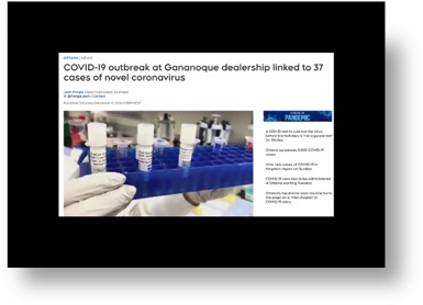 2 hands holding a tray with covid test tubes in the tray