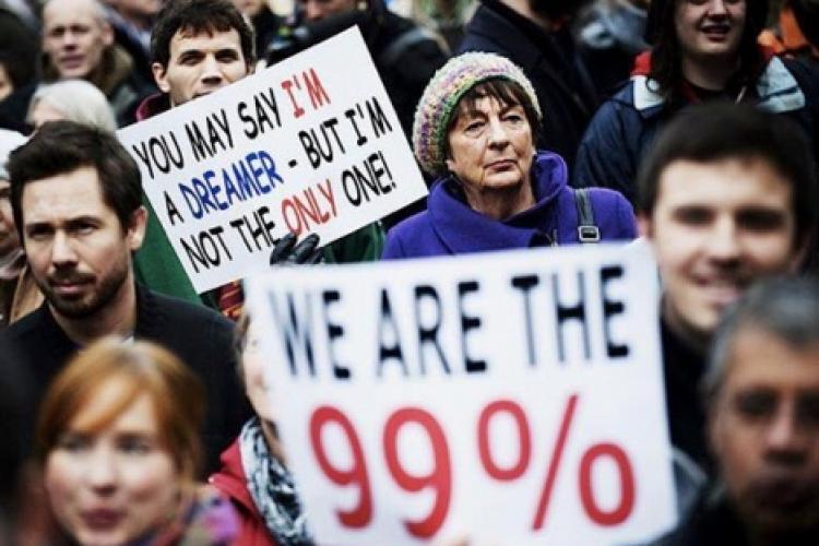 photo of protesters in crowd with signs