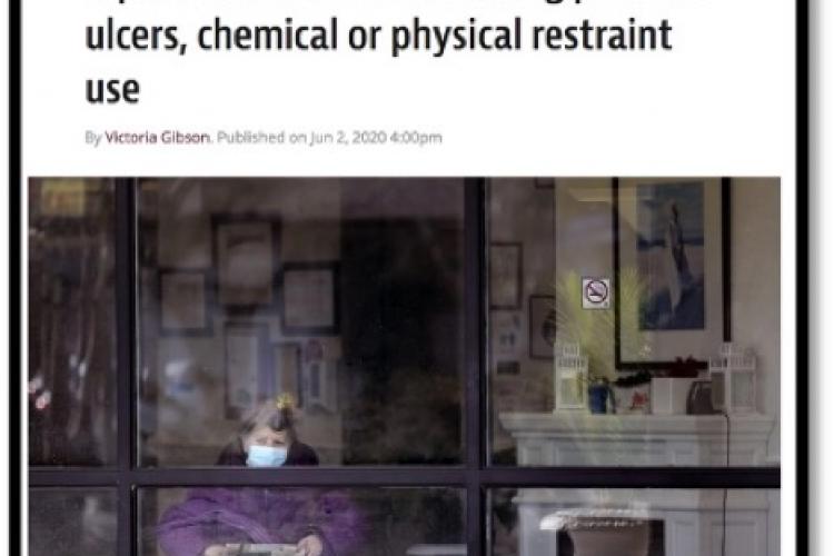 senior citizen sitting in wheel chair looking out window