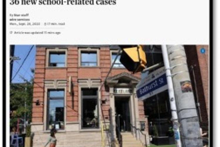 news article stating 700 case in Ontario shows building and street sign