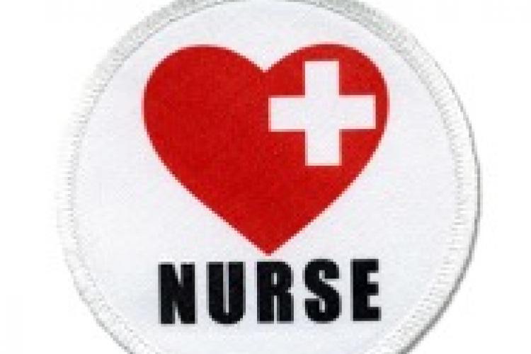 white patch with red heart and the word nurse under it