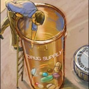 man on top of ladder leaning over a pill bottle