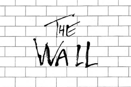 The Wall text on a background of a brick wall